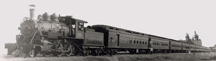 Number 29 and her consist of varnish ready to depart Merced.